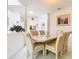 Open dining room with a decorative painting and plenty of natural light at 7323 Cypress Grove Rd # 87, Orlando, FL 32819