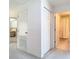 Hallway view with closets, entry to bedroom, and access to a full bathroom at 7323 Cypress Grove Rd # 87, Orlando, FL 32819