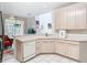 Bright kitchen featuring neutral countertops and an open layout at 7323 Cypress Grove Rd # 87, Orlando, FL 32819