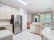 Bright kitchen with white countertops and stainless steel appliances at 7323 Cypress Grove Rd # 87, Orlando, FL 32819