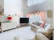 Bright living room with a large window, comfortable seating, and stylish decor at 7323 Cypress Grove Rd # 87, Orlando, FL 32819