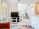 Bright living room featuring tile floors, a staircase, and access to the outdoor patio at 7323 Cypress Grove Rd # 87, Orlando, FL 32819