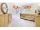 Main bedroom with natural light, complemented by a classic dresser at 7323 Cypress Grove Rd # 87, Orlando, FL 32819