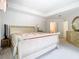 Spacious main bedroom featuring natural light, a comfortable bed and views of the bathroom at 7323 Cypress Grove Rd # 87, Orlando, FL 32819