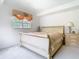 Bright main bedroom featuring a comfortable bed, natural light, and a traditional nightstand at 7323 Cypress Grove Rd # 87, Orlando, FL 32819