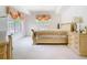 The main bedroom features ample natural light from two windows with decorative valances at 7323 Cypress Grove Rd # 87, Orlando, FL 32819
