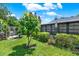 Expansive backyard featuring lush green lawn and beautiful landscaping for outdoor enjoyment at 8248 Limetree Ct, Orlando, FL 32836