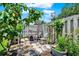Cozy backyard patio area, furnished and surrounded by lush foliage, providing a private outdoor retreat at 8248 Limetree Ct, Orlando, FL 32836