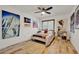 Stylish bedroom featuring light wood floors and modern decor with a ceiling fan at 8248 Limetree Ct, Orlando, FL 32836