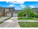 Charming townhome with two-car garage and well-manicured front lawn, perfect for suburban living at 8248 Limetree Ct, Orlando, FL 32836