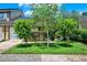 Well-maintained front yard with lush green grass and neatly trimmed bushes enhancing curb appeal at 8248 Limetree Ct, Orlando, FL 32836