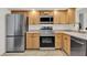 Functional kitchen featuring stainless steel appliances and ample cabinet space, great for cooking at 8248 Limetree Ct, Orlando, FL 32836