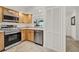 Bright kitchen showcasing stainless steel appliances and built-in storage, enhancing culinary experience at 8248 Limetree Ct, Orlando, FL 32836