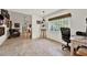 Versatile office space with natural light, adjacent to a comfortable living area at 8248 Limetree Ct, Orlando, FL 32836