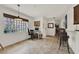 Bright office with a large window, neutral tile, and adjacent kitchen access at 8248 Limetree Ct, Orlando, FL 32836