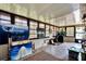 Bright sunroom with lots of windows, natural light, and art pieces on display at 8248 Limetree Ct, Orlando, FL 32836