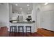 Kitchen with white cabinets, stainless steel appliances and bar stool seating at 860 N Orange Ave # 448, Orlando, FL 32801