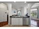 Modern kitchen with sleek countertops, stainless steel dishwasher, and open layout to the living area at 860 N Orange Ave # 448, Orlando, FL 32801