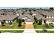 Aerial view of a well-maintained residential neighborhood, highlighting the home's location within the community at 9356 St Therese St, Groveland, FL 34736