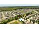 Aerial view of the neighborhood, showing houses and community pool at 9356 St Therese St, Groveland, FL 34736