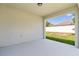 Covered patio with a view of the fenced backyard and blue sky at 9356 St Therese St, Groveland, FL 34736