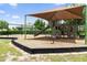 Community playground featuring a covered play structure and wood chip ground cover at 9356 St Therese St, Groveland, FL 34736