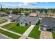 Aerial view of the home with a well-manicured lawn at 9447 Brackin St, Orlando, FL 32825