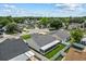 Bird's eye of the backyard featuring green lawn, white fence, and screened patio at 9447 Brackin St, Orlando, FL 32825