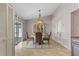 Cozy dining area with chandelier and cabinet at 9447 Brackin St, Orlando, FL 32825