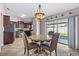 Cozy dining area with chandelier and sliding glass doors at 9447 Brackin St, Orlando, FL 32825
