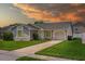 A charming home with a well-manicured front lawn and a two-car garage at 9447 Brackin St, Orlando, FL 32825