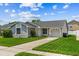 Charming single-story home with well-maintained lawn, mature landscaping, and covered entryway at 9447 Brackin St, Orlando, FL 32825