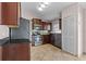 Updated kitchen with stainless steel appliances and dark cabinets at 9447 Brackin St, Orlando, FL 32825