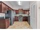 Updated kitchen with stainless steel appliances and dark cabinets at 9447 Brackin St, Orlando, FL 32825
