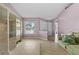 Inviting living room with tile flooring, neutral walls, natural light, and comfortable seating at 9447 Brackin St, Orlando, FL 32825