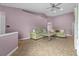 Spacious living room featuring tile floors, high ceilings, comfortable seating, and neutral paint at 9447 Brackin St, Orlando, FL 32825