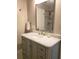 Bathroom featuring marble countertops, a single sink, and tiled shower at 983 Bucksaw Pl, Longwood, FL 32750