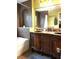 Well-appointed bathroom with dual sinks, a bathtub, and decorative fixtures at 983 Bucksaw Pl, Longwood, FL 32750