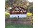 Elegant Hidden Oak Estates sign surrounded by lush landscaping and brickwork at 983 Bucksaw Pl, Longwood, FL 32750