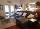 Bright living room featuring a sectional sofa, and access to the outdoor patio at 983 Bucksaw Pl, Longwood, FL 32750