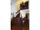 Open staircase with wooden railings leading to the second floor at 983 Bucksaw Pl, Longwood, FL 32750