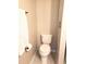 Standard height toilet with adjacent towel rack and tile flooring at 983 Bucksaw Pl, Longwood, FL 32750