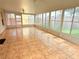 Enclosed patio with tile flooring and many windows to let in natural light, creating a relaxing retreat at 12756 Maribou Cir, Orlando, FL 32828