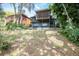 Large backyard featuring lush vegetation and a view of the multi-story house at 1502 E Gore St, Orlando, FL 32806