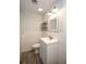 Modern bathroom featuring gray flooring, a white vanity, and stylish fixtures at 1502 E Gore St, Orlando, FL 32806