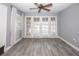 Bright bedroom with tile floors, ceiling fan, and access to the outdoors at 1502 E Gore St, Orlando, FL 32806