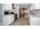 Modern kitchen with stainless steel appliances, stone countertops, and tile floors at 1502 E Gore St, Orlando, FL 32806