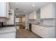 Modern kitchen with stainless steel appliances, stone countertops, and tile floors at 1502 E Gore St, Orlando, FL 32806