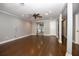 Bright living room with hardwood floors, ceiling fan, and neutral color scheme at 1502 E Gore St, Orlando, FL 32806