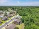 Community aerial view with houses nestled among lush trees and a tranquil neighborhood setting at 1551 Peterson Pl, Sanford, FL 32773